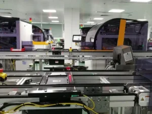 Lens cutting equipment in eyewear manufacturing facility